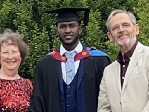 yonas celebrates his  graduation with his hosts