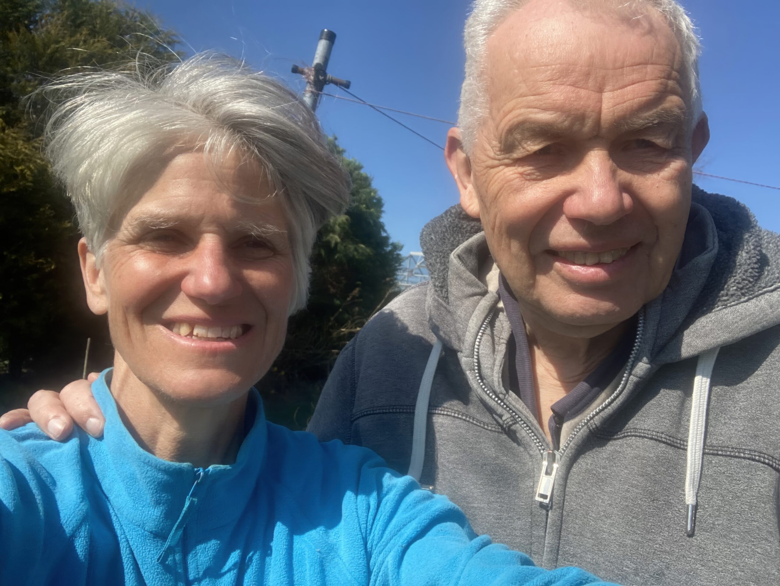 A selfie of a man and a woman outside